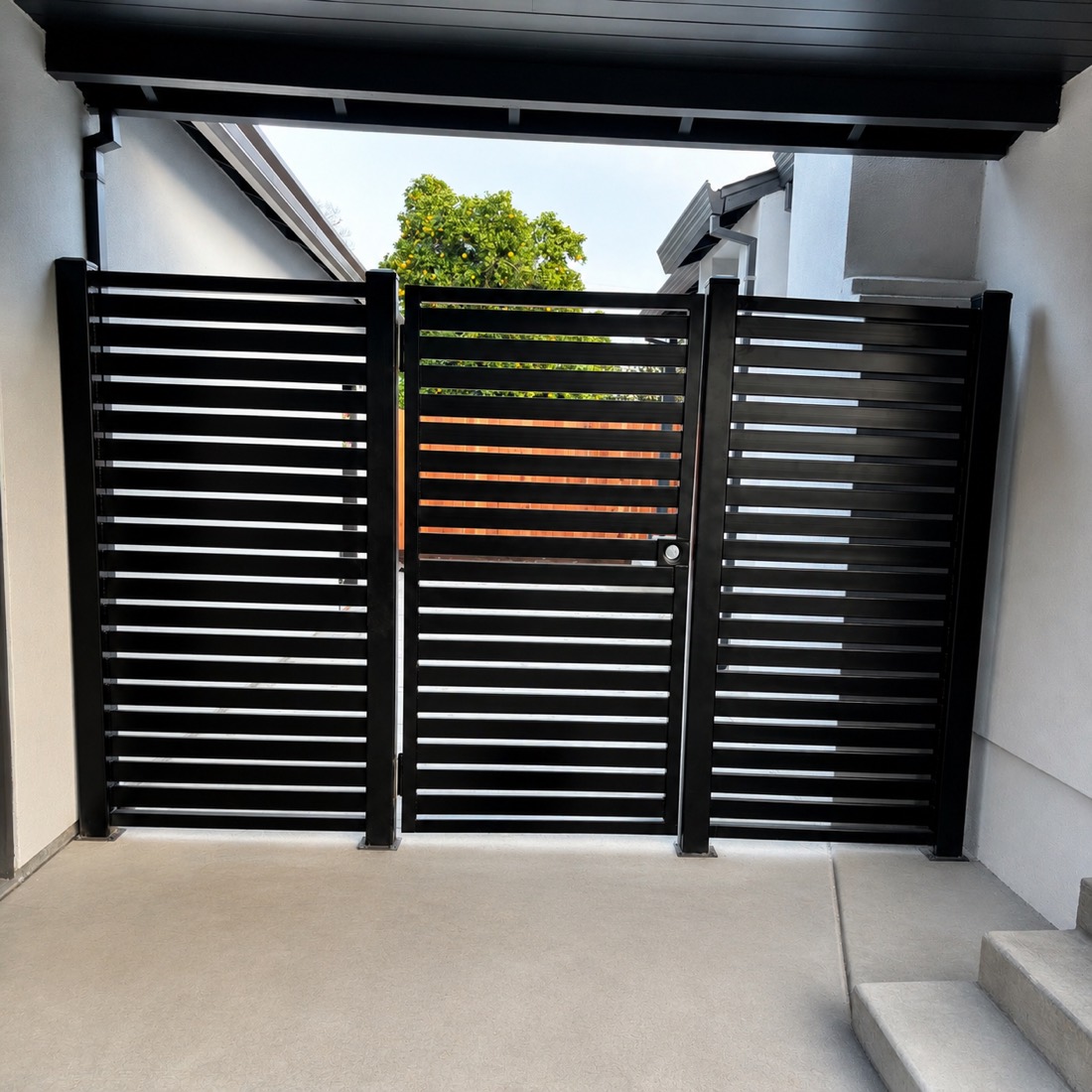Modern black horizontal-slat steel gate with wood accent slats
