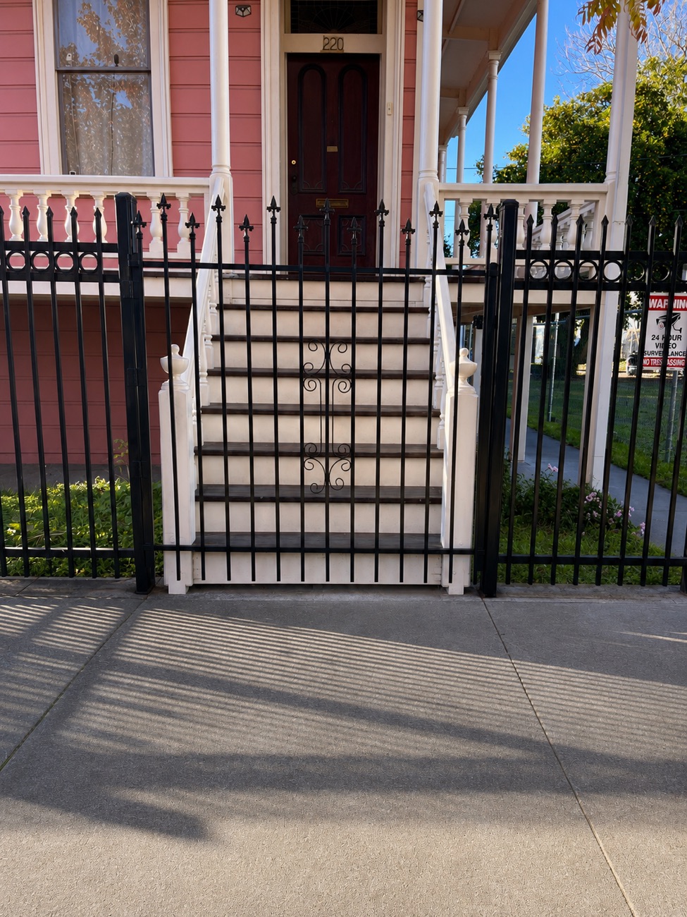 Spear-top iron security fence with decorative circle motif